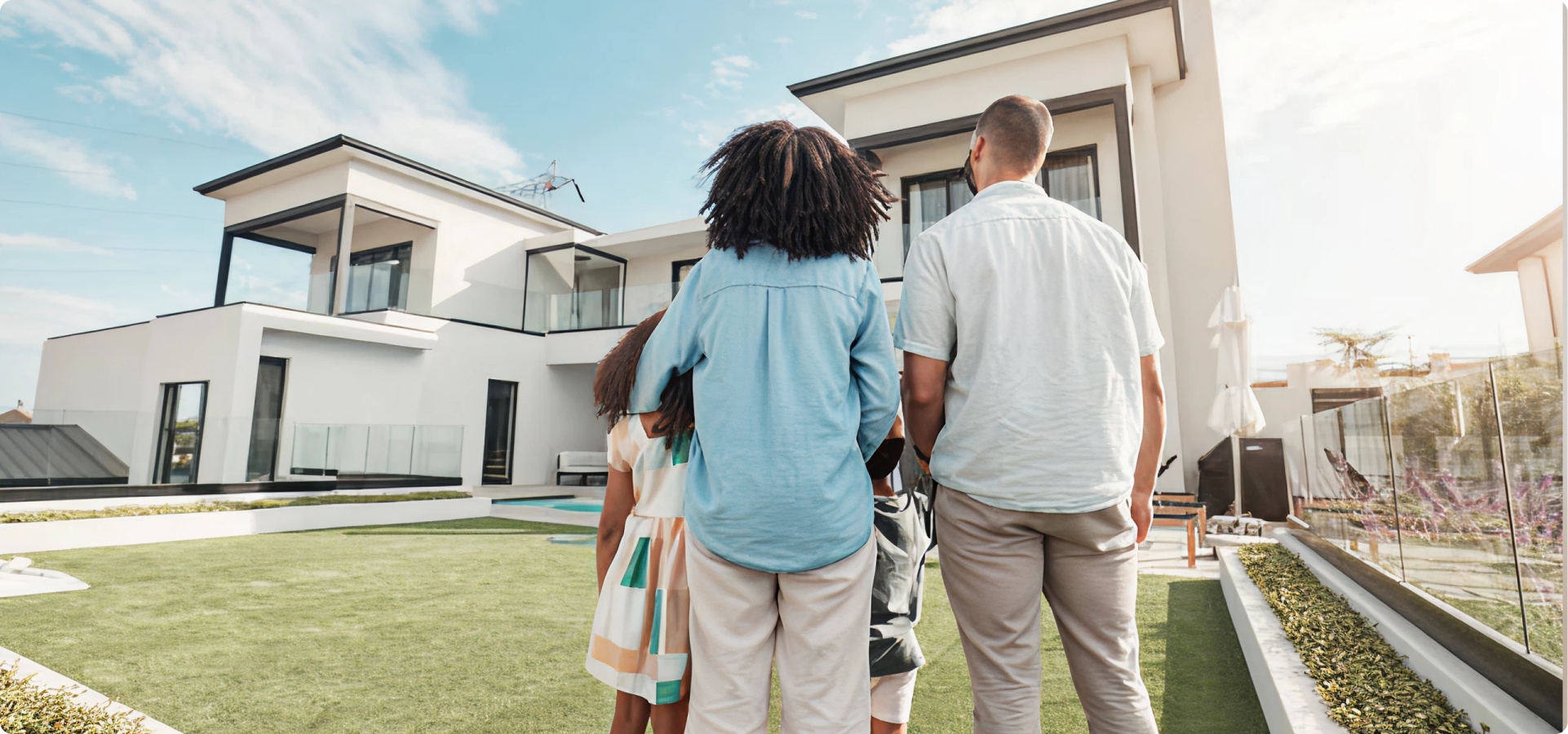 Family looking at their house.